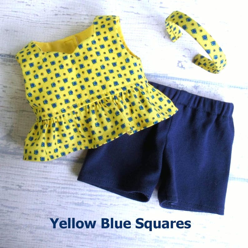 This summer set for your 18 inch doll includes a sleeveless top with peplum ruffle made from yellow cotton with a pattern of blue and green squares all over.  Included is a pair of blue stretch knit shorts and a headband made from the shirt fabric.