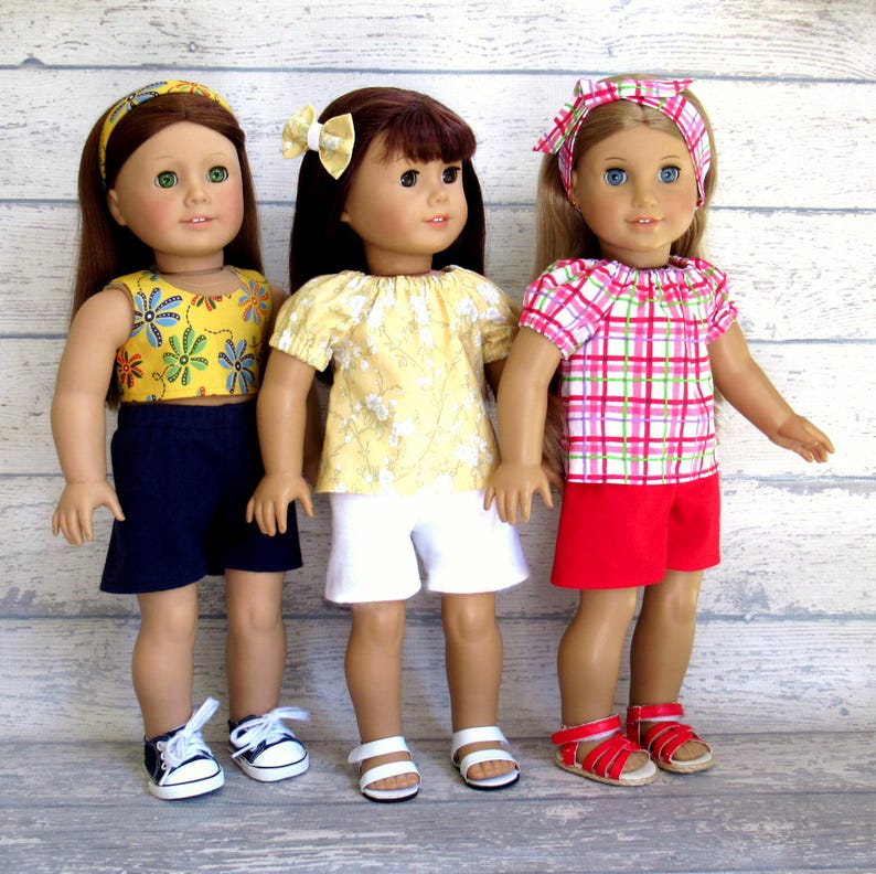 Multiple summer outfits for 18 inch dolls.  Each set includes a shirt, shorts, and hair accessory.  You choose from nine different sets.