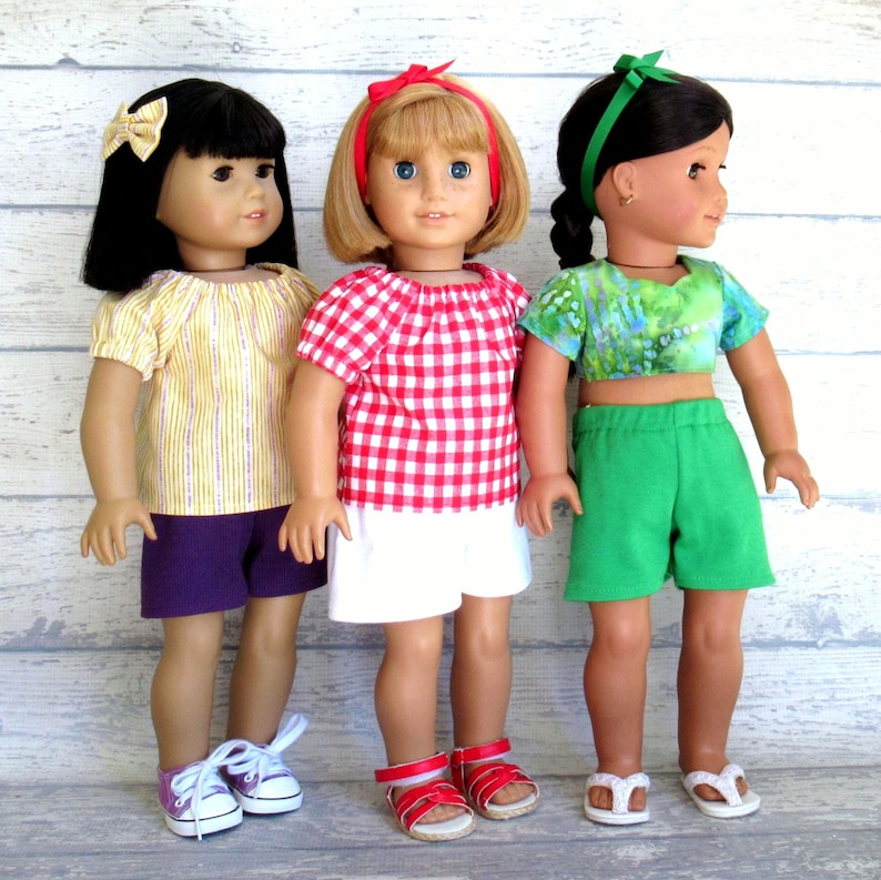Multiple summer outfits for 18 inch dolls.  Each set includes a shirt, shorts, and hair accessory.  You choose from nine different sets.