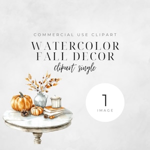 May include: Watercolour illustration of a fall-themed table setting with a pumpkin, a vase of autumn foliage, a candle, and books. The table is white and round with a pedestal base.