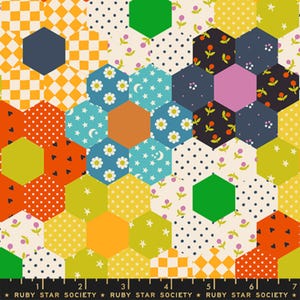 May include: A colorful patchwork fabric with a hexagonal pattern. The design features various patterns, including polka dots, floral prints, and checkered patterns, in shades of yellow, orange, blue, green, and black. The text "RUBY STAR SOCIETY" is printed at the bottom.