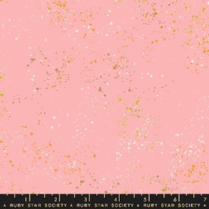 May include: Pink fabric with a scattered pattern of small white, gold, and brown dots.