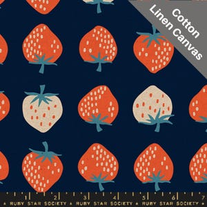 May include: A dark blue cotton linen canvas fabric featuring a repeating pattern of stylized strawberries. The strawberries are primarily orange with white seed details and blue-green stems. The text "Cotton Linen Canvas" is visible.