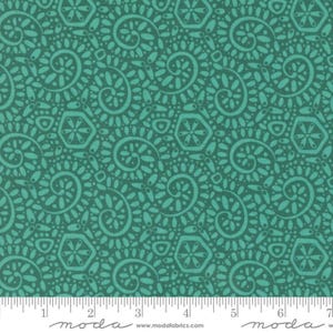 May include: Teal fabric with a repeating pattern of swirls, dots, and geometric shapes. The fabric is from the Moda Fabrics line.