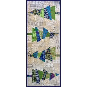 May include: A patchwork quilt with a design of four green, blue, and white Christmas trees. The trees are made of different fabrics with various patterns.