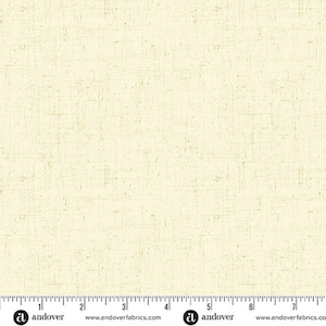 May include: Cream-colored fabric with a textured, woven appearance. The fabric has a subtle, irregular pattern with faint, lighter-colored lines. The Andover Fabrics logo is visible at the bottom, along with a ruler for scale.