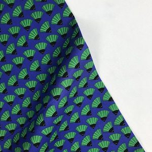 May include: Blue fabric with a repeating pattern of green fans. The fans have a black outline.