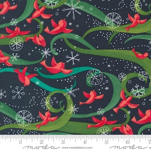 May include: A dark blue fabric with a repeating pattern of red birds flying through green swirling vines. The background is dotted with white snowflakes and circles. The fabric is marked with a ruler in inches.