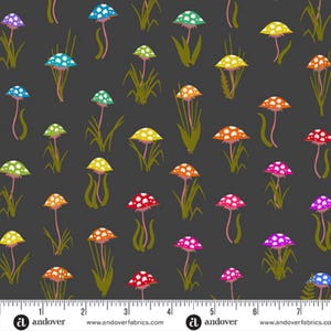May include: Dark gray fabric with a repeating pattern of colorful mushrooms. The mushrooms have white polka dots on their caps and are in shades of blue, green, yellow, orange, red, and pink. Green grass-like shapes are also present. The text "andoverfabrics.com" is at the bottom.