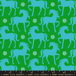 May include: A green fabric with a repeating pattern of blue horses and white flowers. The horses are stylized and have a whimsical look.