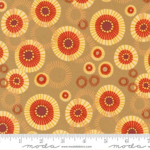 May include: A brown fabric with a repeating pattern of yellow, red, and orange circles with a radiating design. The fabric has a subtle texture and a slightly distressed look.