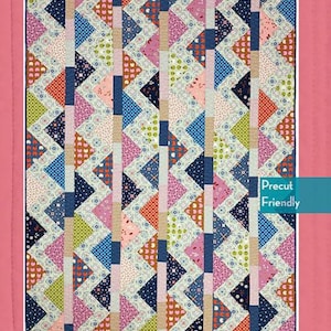 May include: A quilt pattern with a colorful geometric design. The quilt features triangles in various colors, including blue, pink, orange, and green. The pattern is labeled "secondhand gem" and includes size options of 38" x 53" and 58" x 79".