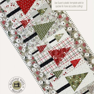 May include: A Christmas-themed table runner with a "Fa la la Forest" design. The runner features a patchwork of green, red, and white fabrics with a repeating pattern of stylized Christmas trees. The runner is 18 1/2 inches by 45 1/2 inches.