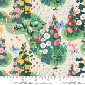 May include: A white fabric with a green, pink, and yellow floral pattern. The fabric features butterflies, bees, and strawberries. The fabric is printed with the text "moda" and "www.modafabrics.com".