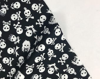 May include: Black fabric with a white skull and crossbones pattern. The skulls have different facial expressions and some have mohawks. There are also guitar picks, lightning bolts, and bandanas in the pattern.