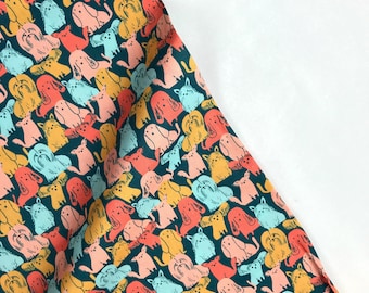 May include: Teal fabric with a repeating pattern of colorful dogs in various poses. The dogs are drawn in a simple, cartoon style and are outlined in black. The fabric is perfect for quilting, sewing, or crafting.
