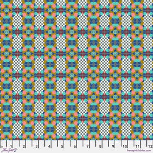 May include: A patterned fabric with a repeating design of geometric shapes in teal, pink, gold, and grey. The background features a black and white checkered pattern. The fabric is marked with inch measurements along the bottom.