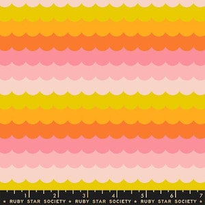 May include: A fabric pattern featuring repeating horizontal rows of scalloped waves in shades of yellow, orange, pink, and light blush. A black selvage edge at the bottom displays the text RUBY STAR SOCIETY with a ruler measuring up to 7 inches.