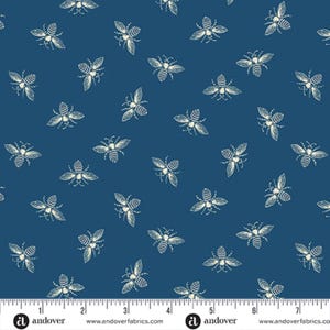 May include: A blue fabric with a white repeating pattern of bees. The fabric has a ruler with inches marked on it.