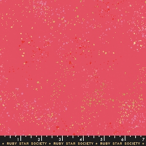 May include: Pink fabric with a scattered pattern of gold and pink dots.