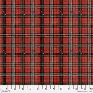 May include: Red and black plaid fabric with thin yellow stripes. The fabric has a vintage, distressed look. The image includes a ruler along the bottom edge, with the text "in" and "Free Spirit fabrics.com".