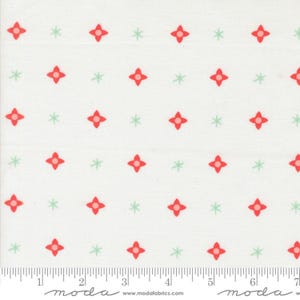 May include: White fabric with a repeating pattern of red four-petal flowers and light green star-shaped accents. The fabric has a ruler along the bottom edge and the word "moda" is printed on the bottom.