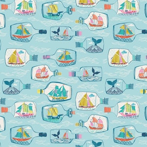 May include: A repeating pattern of whimsical ships in bottles on a light blue background. The ships have colorful sails and are set against a backdrop of stylized waves. Some bottles feature whale illustrations.