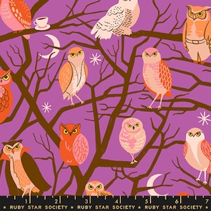 May include: Fabric featuring a purple background with dark brown tree branches, white crescent moons, and starbursts. Various owls in shades of orange, pink, and white are perched on the branches. A small white teacup sits on a branch.
