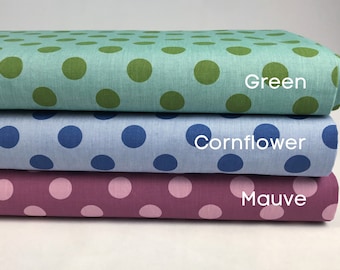 May include: Three fabric swatches with white polka dots on a solid background. The top swatch is teal with green polka dots and the text "Green". The middle swatch is light blue with dark blue polka dots and the text "Cornflower". The bottom swatch is mauve with pink polka dots and the text "Mauve".