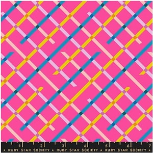 May include: A vibrant pink fabric with a repeating diagonal pattern of intersecting lines in blue, yellow, and light pink. The fabric has a grid-like design, with the text "RUBY STAR SOCIETY" along the bottom edge.