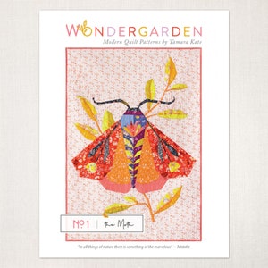 May include: A print showcasing a vibrant moth design in shades of orange, red, and blue, set against a dotted backdrop. The text "WONDERGARDEN" and "Modern Quilt Patterns by Tamara Kate" are at the top. The text "No 1 the Moth" is at the bottom.