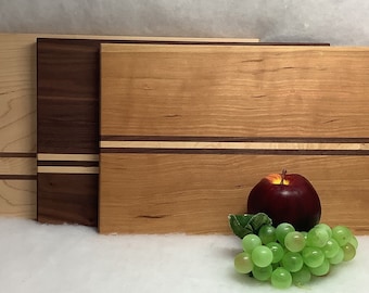 Made in Maine, Beautiful hand made  cutting board with contrasting stripes.   9” x 14”