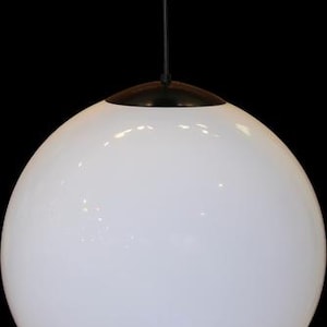 May include: A white globe pendant light fixture with a black metal canopy and cord.