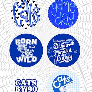 May include: Six round, 3-inch diameter, blue and white decorative items. Designs include the word "CATS" with hearts, "game day", "BORN to be WILD", "CATS BY 90", and a football helmet. The items are on a wavy gray background.