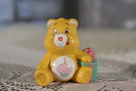 yellow care bear with cupcake