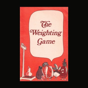 May include: A red and white illustration of a scale with the text "The Weighing Game" and various fruits and vegetables on the scale.