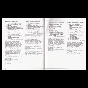 May include: A vintage cookbook page with recipes for marinated bean salad, creamy salad dressing, cucumbers in vinaigrette, and tomato cucumber marinade. The recipes include ingredients, measurements, and serving sizes.