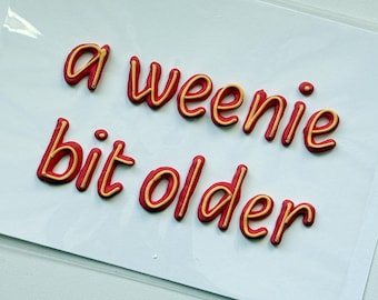 Hand-Piped Royal Icing Cake Topper | "A Weenie Bit Older" Phrase (Edible Transfer)