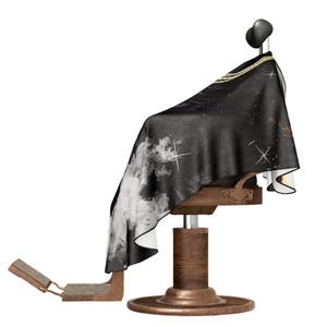 May include: Black barber's chair with a black and white patterned cape. The cape has a gold chain design around the neck.