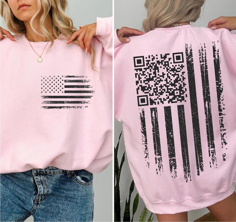 The image is a collage of two photos. In the first photo, a woman is wearing a pink sweatshirt with a black American flag design on the front. In the second photo, the woman is wearing the same pink sweatshirt with a black QR code on the back.