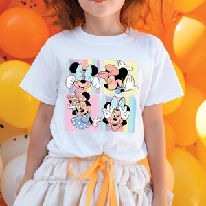 a little girl standing in front of a bunch of balloons