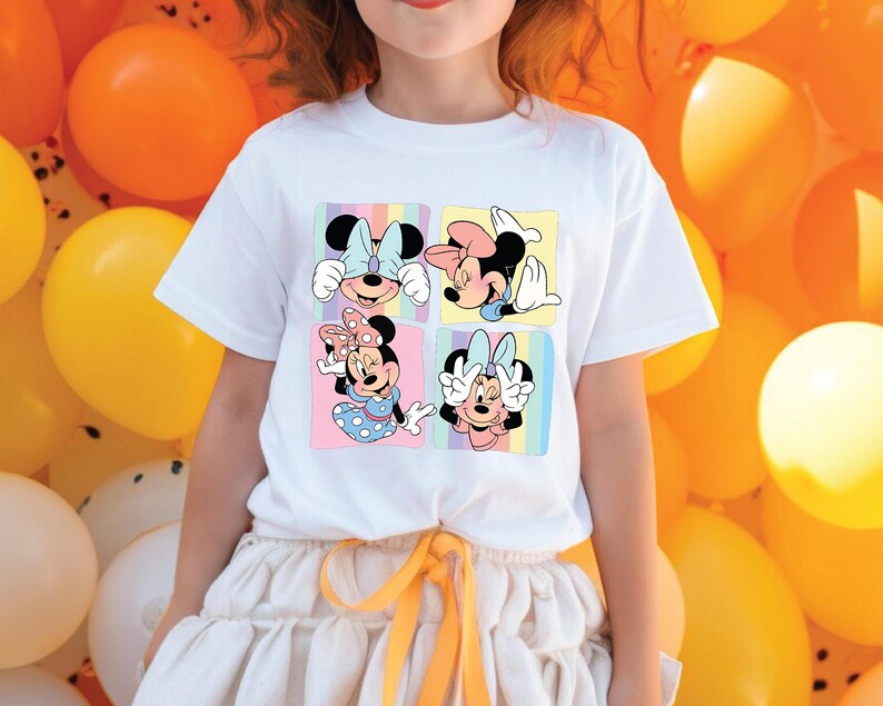 a little girl standing in front of a bunch of balloons