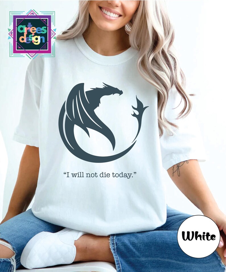 a woman wearing a white t - shirt with a black dragon on it