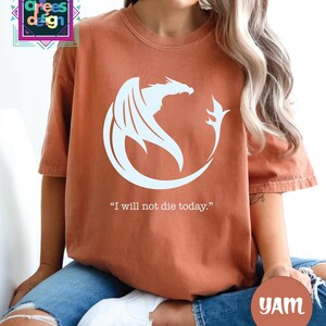 a woman wearing a t - shirt that says i will not die today
