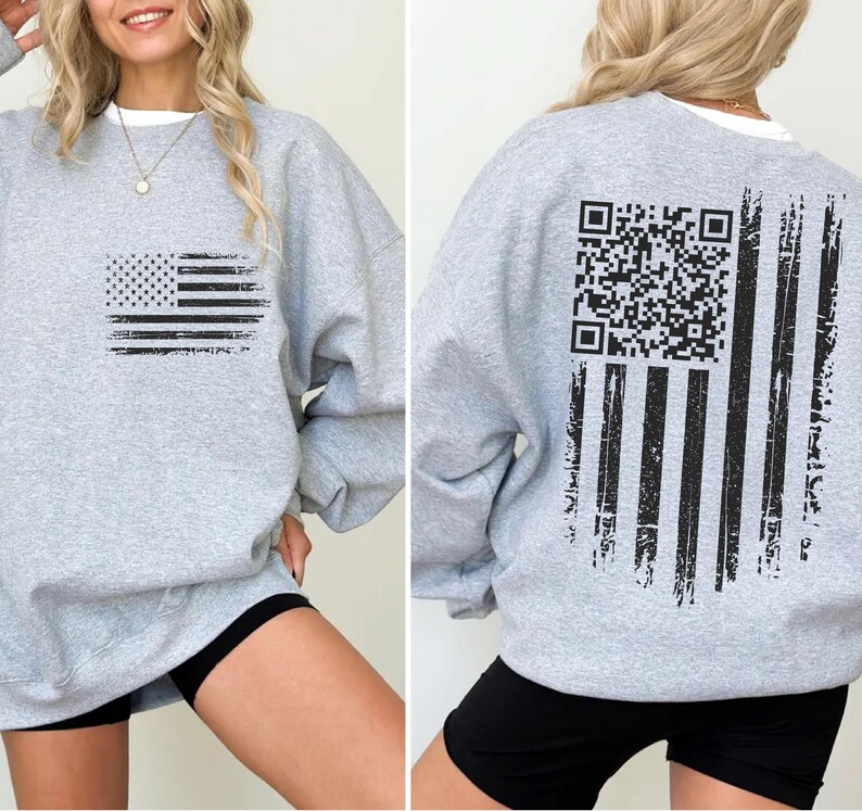 The image is a collage of two photos showing the back and front of a gray sweatshirt with a graphic design featuring an American flag and a QR code.