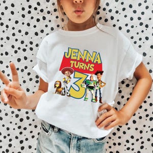 a young girl wearing a t - shirt with the name jenny torns on it