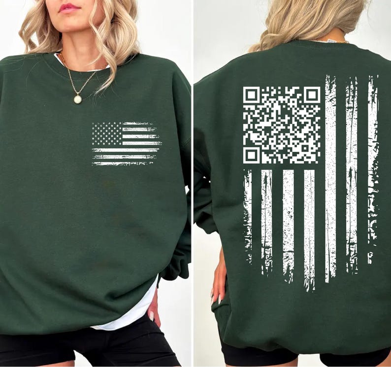 A woman wearing a green sweatshirt with an American flag design and a QR code printed on the back.