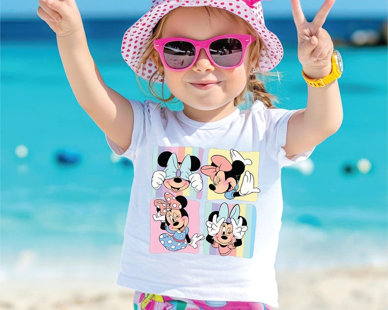 a little girl wearing sunglasses and a minnie mouse shirt