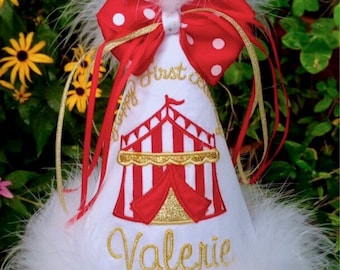 May include: White party hat with a red and white striped tent, gold glitter, and the text "Happy First Birthday Valerie" and "Gingham Bunny".