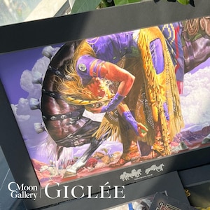 May include: A framed print featuring a detailed illustration of a cowboy on a horse. The cowboy is wearing a purple shirt, fringed yellow chaps, and boots. The horse is dark brown. The print has the text "GICLEE" and "Moon Gallery".